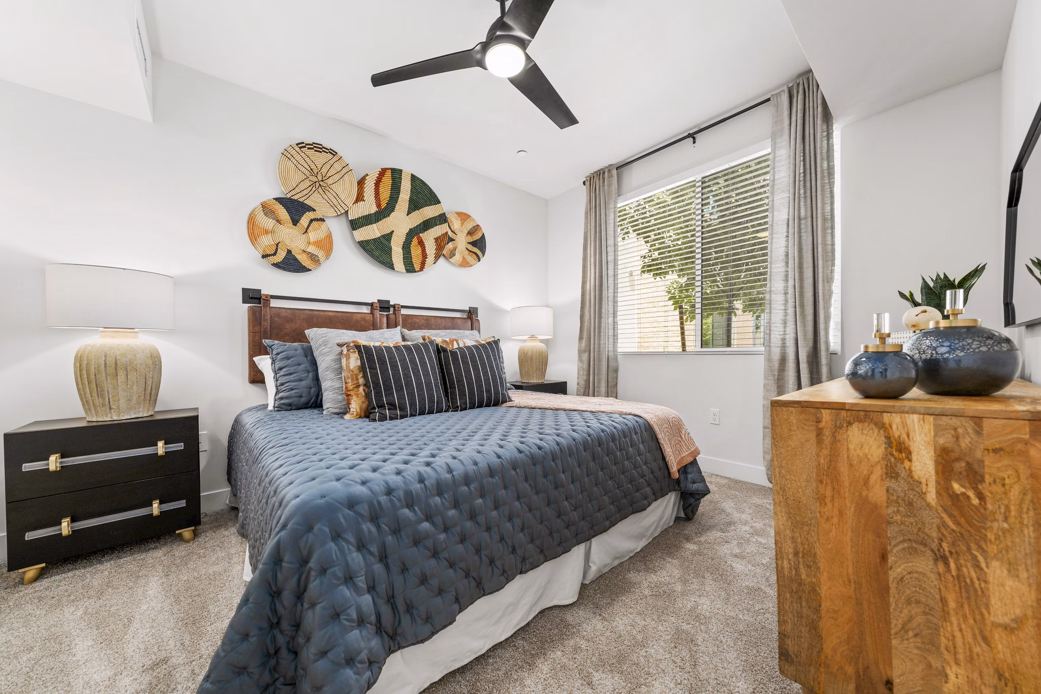 Cozy bedroom with modern furnishings at Overture Arcadia Apartments