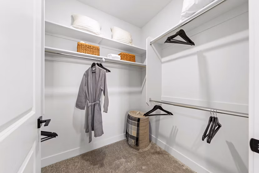 Overture Arcadia Apartments: Walk-in bedroom closet with custom shelving for ample storage in luxury apartments