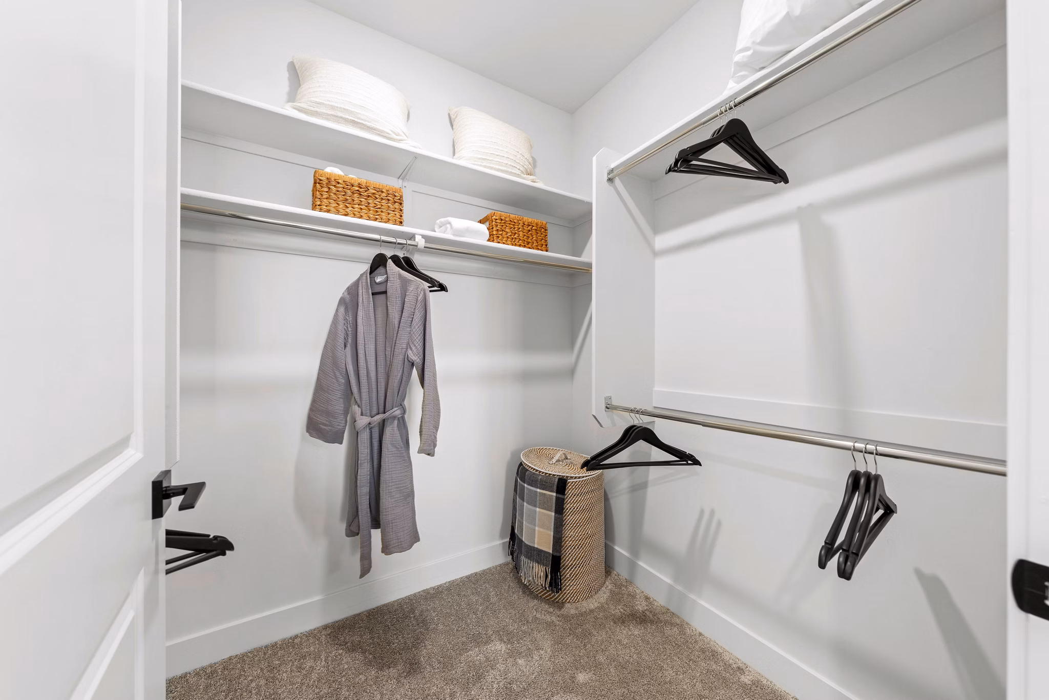 Overture Arcadia Apartments: Walk-in bedroom closet with custom shelving for ample storage in luxury apartments