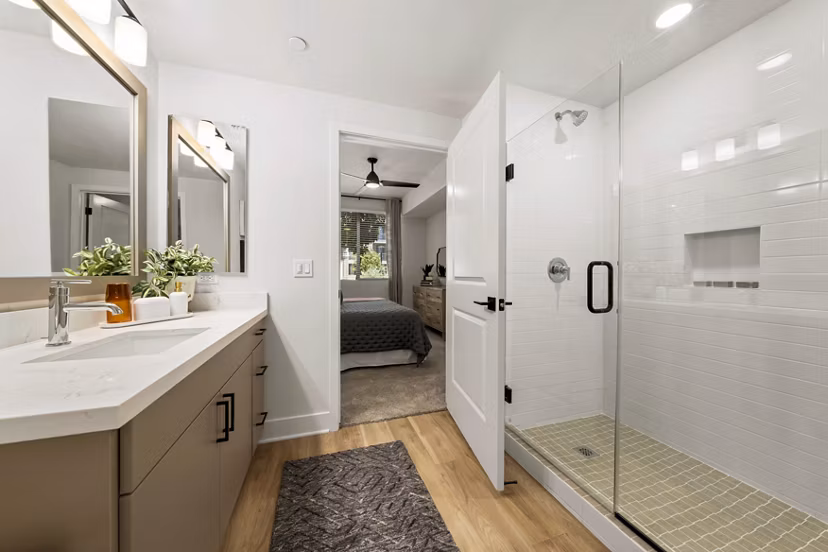 Modern bathroom with sleek fixtures and ample lighting at Overture Arcadia Apartments