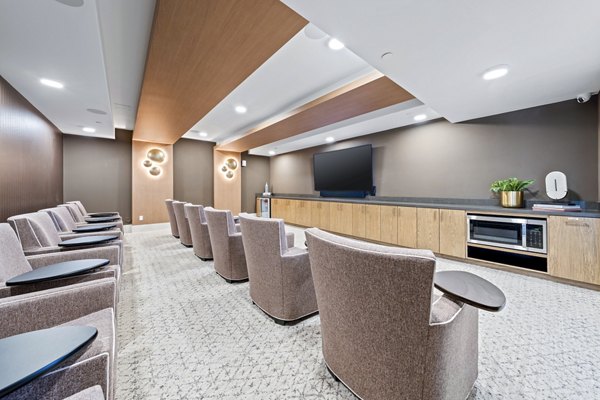 Clubhouse theater with plush seating and large screen at Overture Arcadia Apartments, offering a luxury entertainment experience