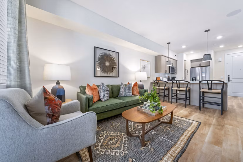 Spacious living room with contemporary design and natural light at Overture Arcadia Apartments, a Greystar property