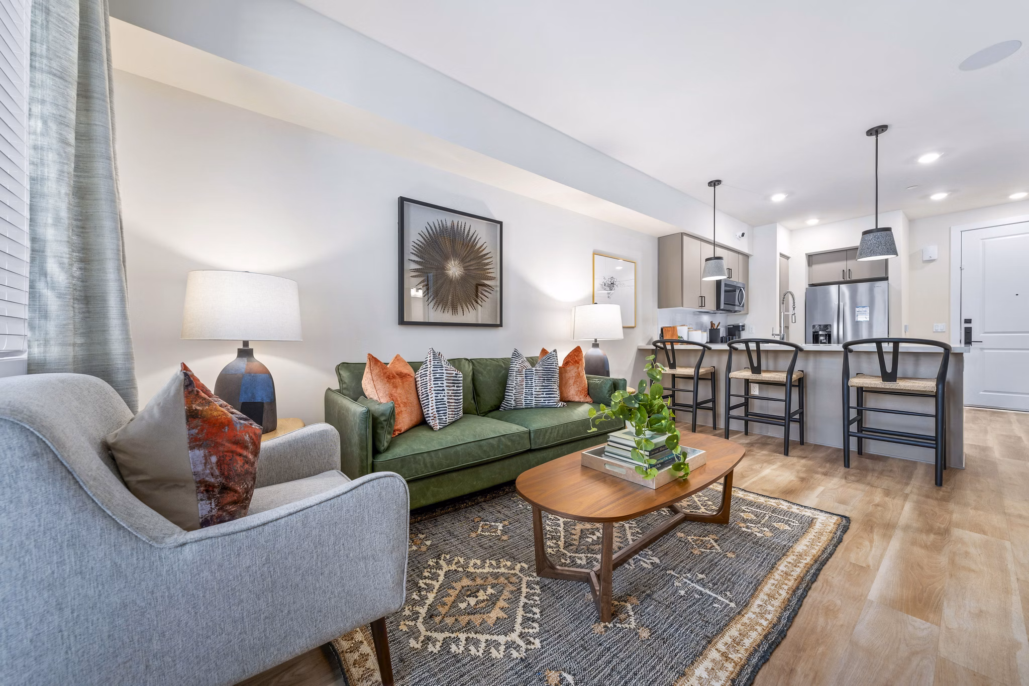 Spacious living room with contemporary design and natural light at Overture Arcadia Apartments, a Greystar property