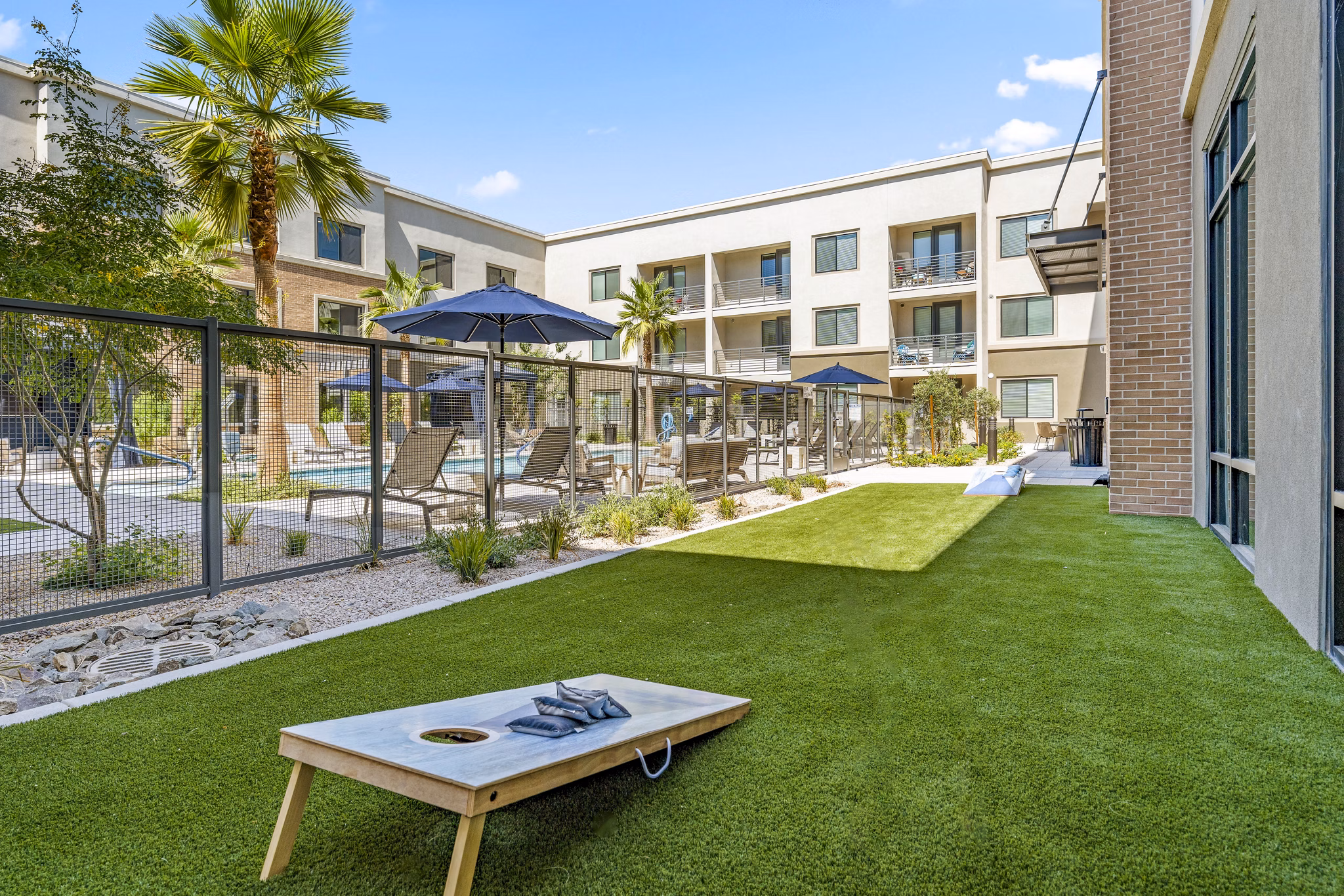 Patio with seating and firepit in recreational area at Overture Arcadia Apartments, a Greystar luxury community