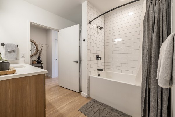 Modern bathroom with sleek fixtures and vanity at Ballard Yards Apartments