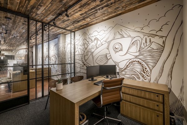 Clubhouse featuring modern seating and pool table at Ballard Yards Apartments
