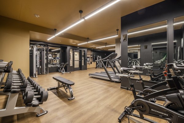 State-of-the-art fitness center at Ballard Yards Apartments featuring modern gym equipment and exercise spaces