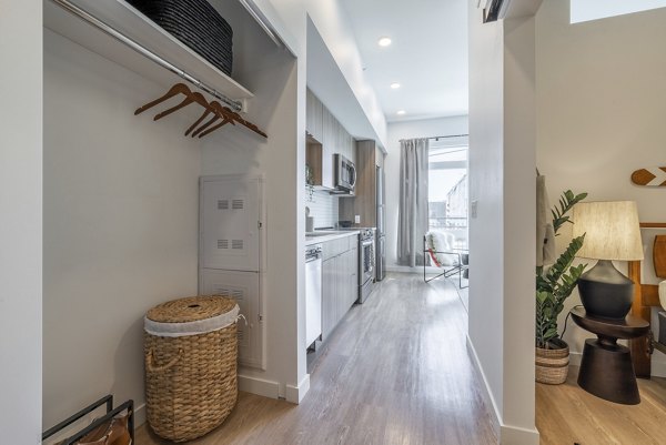 Hallway featuring modern design and ambient lighting at Ballard Yards Apartments in this luxury complex by Greystar
