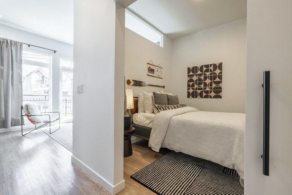 Hallway featuring sleek modern design with stylish lighting in Ballard Yards Apartments