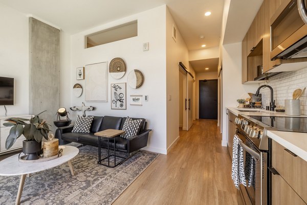 Modern kitchen with stainless steel appliances at Ballard Yards Apartments, perfect for culinary enthusiasts seeking luxury living