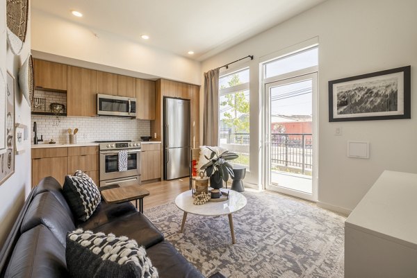 Spacious living room with modern furnishings at Ballard Yards Apartments, ideal for luxury living in a vibrant community