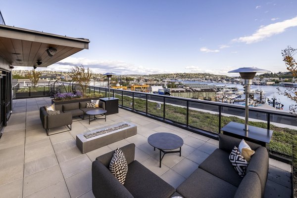 Cozy outdoor fire pit area at Ballard Yards Apartments, perfect for gatherings and relaxation in a luxury setting