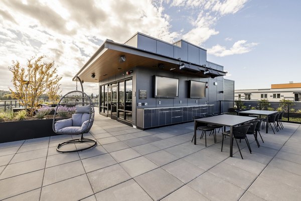 Rooftop deck with panoramic city views at Ballard Yards Apartments