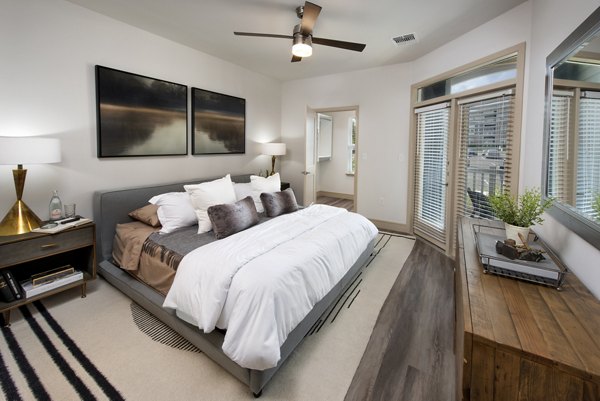 Henry House at Clift Farm: Modern bedroom with elegant decor and ample natural light in luxury apartments