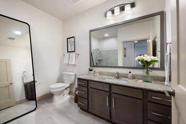 Henry House at Clift Farm Apartments: Modern bathroom with elegant fixtures and spacious vanity