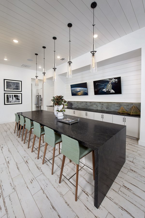 Modern clubhouse with cozy seating and elegant decor at Henry House at Clift Farm Apartments