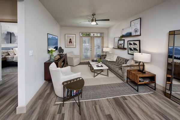 Spacious living room with modern decor in Henry House at Clift Farm Apartments