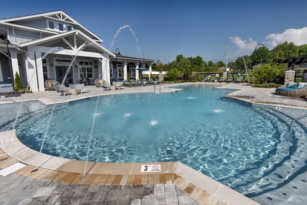 Inviting swimming pool at Henry House at Clift Farm Apartments, perfect for leisure and relaxation in a luxurious setting