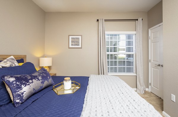 Luxurious bedroom with plush bedding and stylish decor in Park Crossing Apartments, showcasing comfort and elegance in modern apartment living