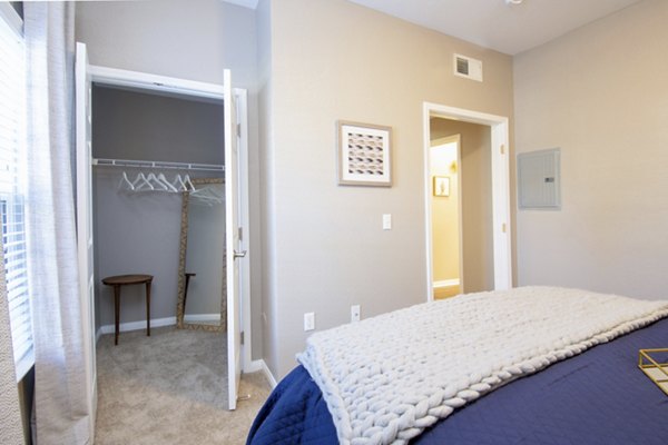 Cozy bedroom with modern decor and large windows at Park Crossing Apartments