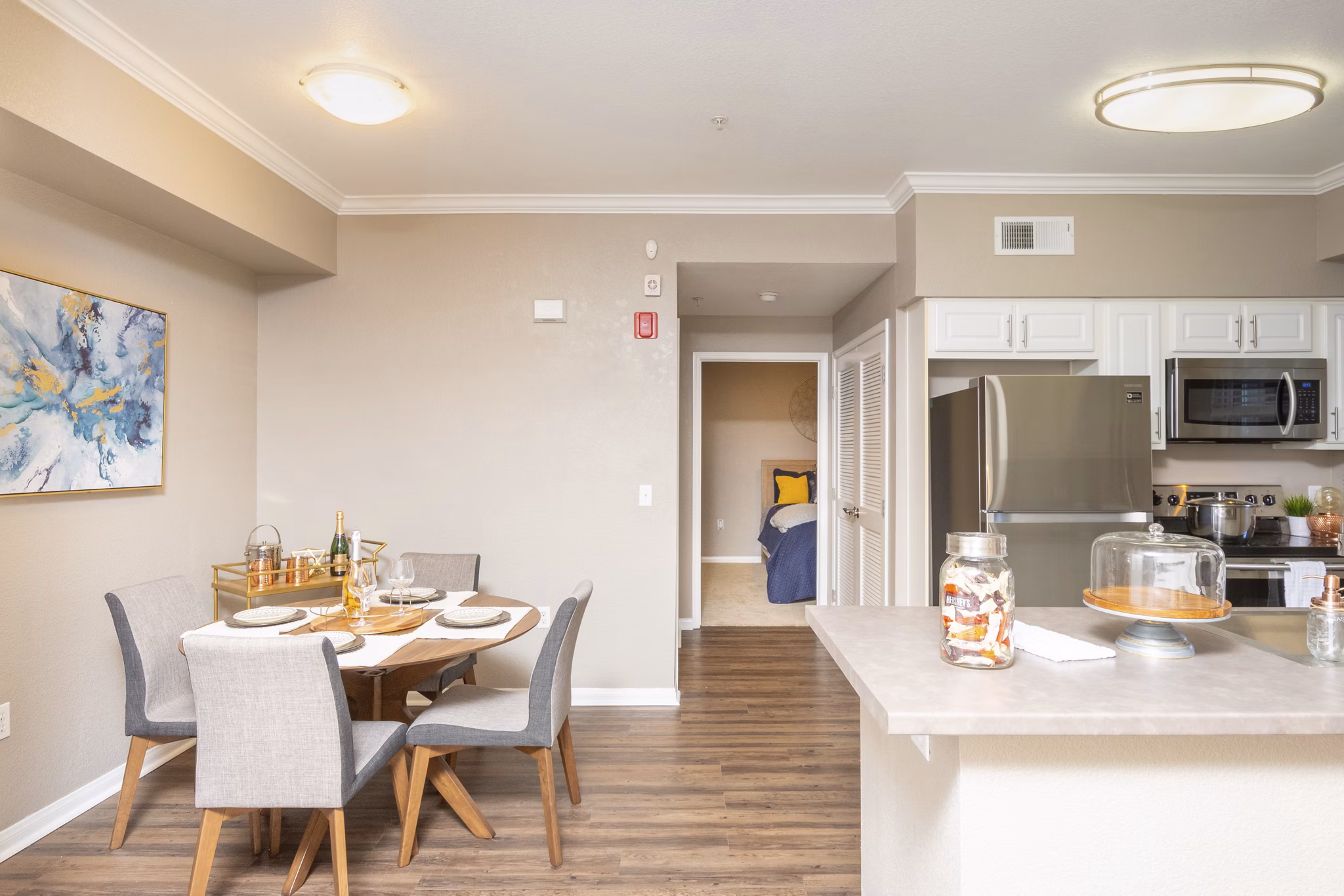 Dining area with elegant seating and modern lighting at Park Crossing Apartments, a Greystar luxury development
