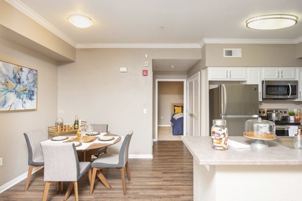 Dining area with elegant seating and modern lighting at Park Crossing Apartments, a Greystar luxury development