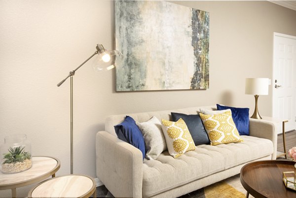 Modern living room with elegant furniture and natural light at Park Crossing Apartments