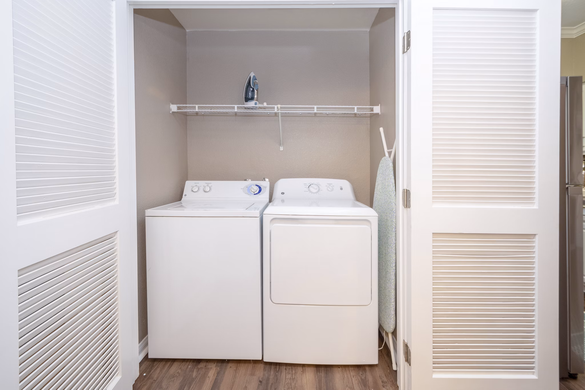 Laundry room with modern appliances at Park Crossing Apartments