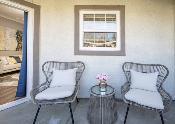 Modern patio with comfortable seating at Park Crossing Apartments, perfect for relaxation and outdoor gatherings