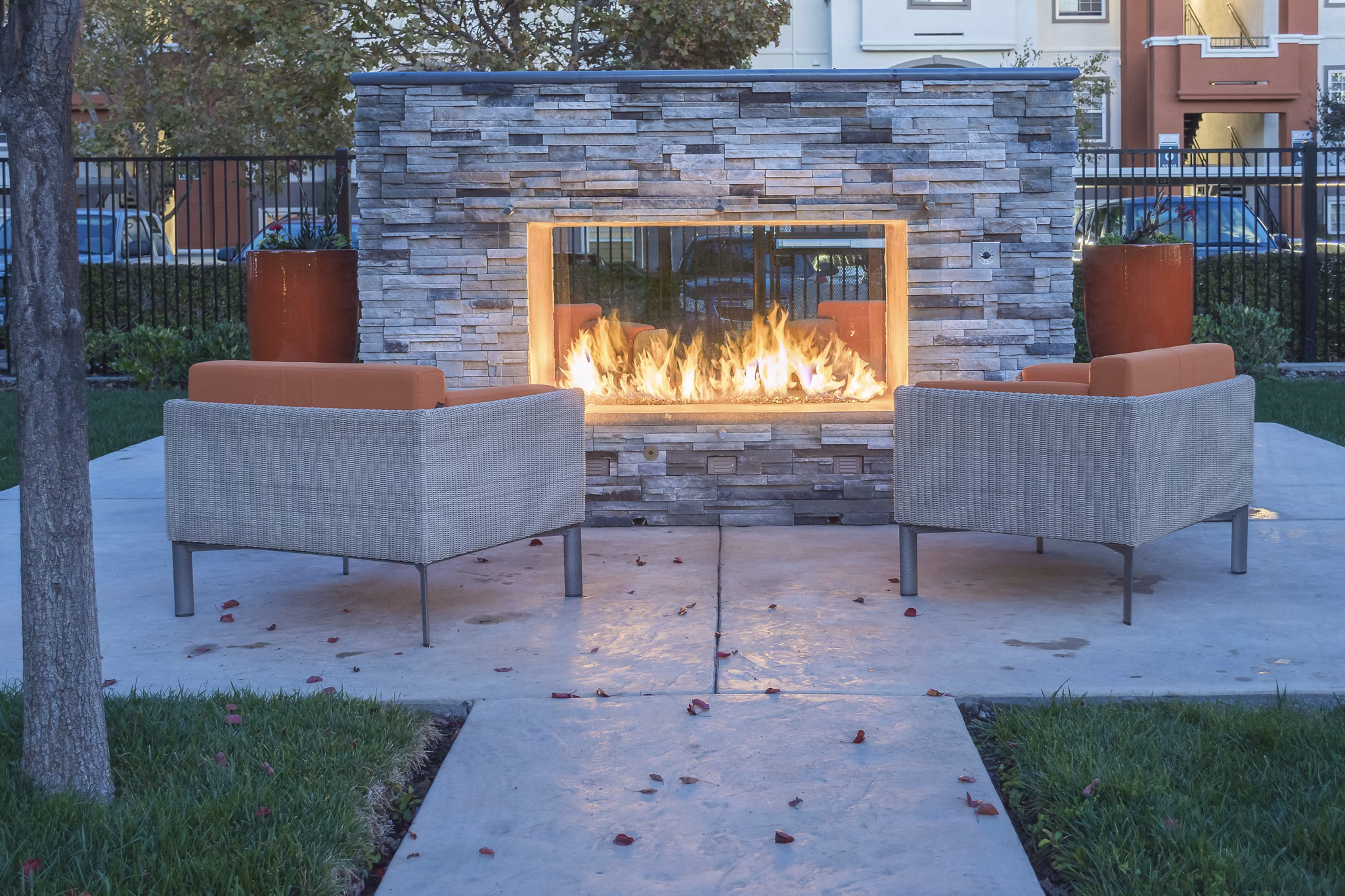 Outdoor fire pit surrounded by cozy seating at Park Crossing Apartments, a luxury Greystar community