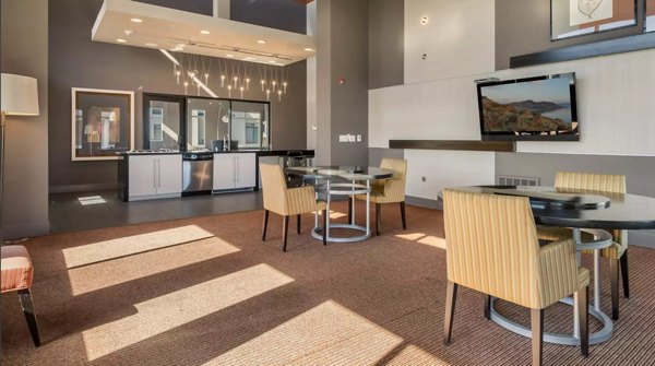 Modern clubhouse with open seating and stylish decor at Westgate Apartments
