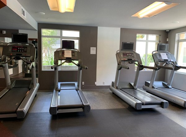 Modern fitness center featuring advanced equipment at Westgate Apartments