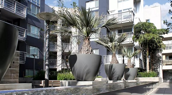 Courtyard with lush landscaping at Westgate Apartments, a luxury property featuring modern amenities and comfortable living spaces