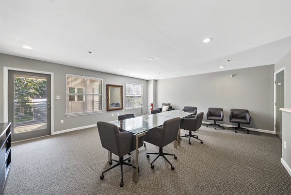 Meeting facility featuring modern conference table and seating at Concord Apartments in luxurious setting