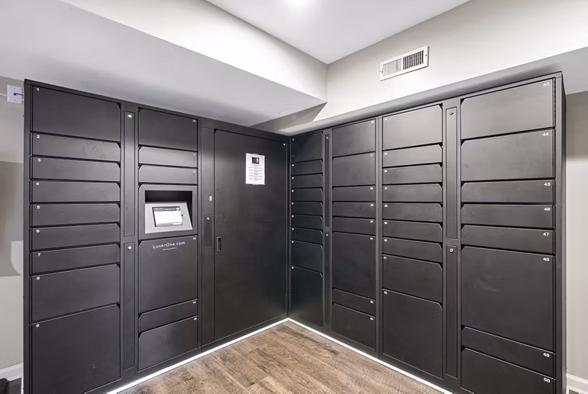 Mail room with organized postal boxes at Concord Apartments in Greystar community