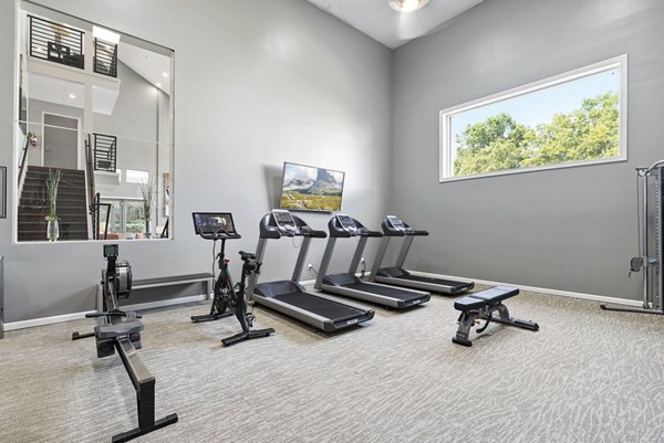 Modern fitness center with state-of-the-art equipment at Concord Apartments