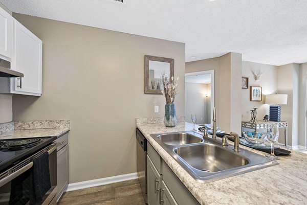 Modern kitchen with stainless steel appliances at Concord Apartments