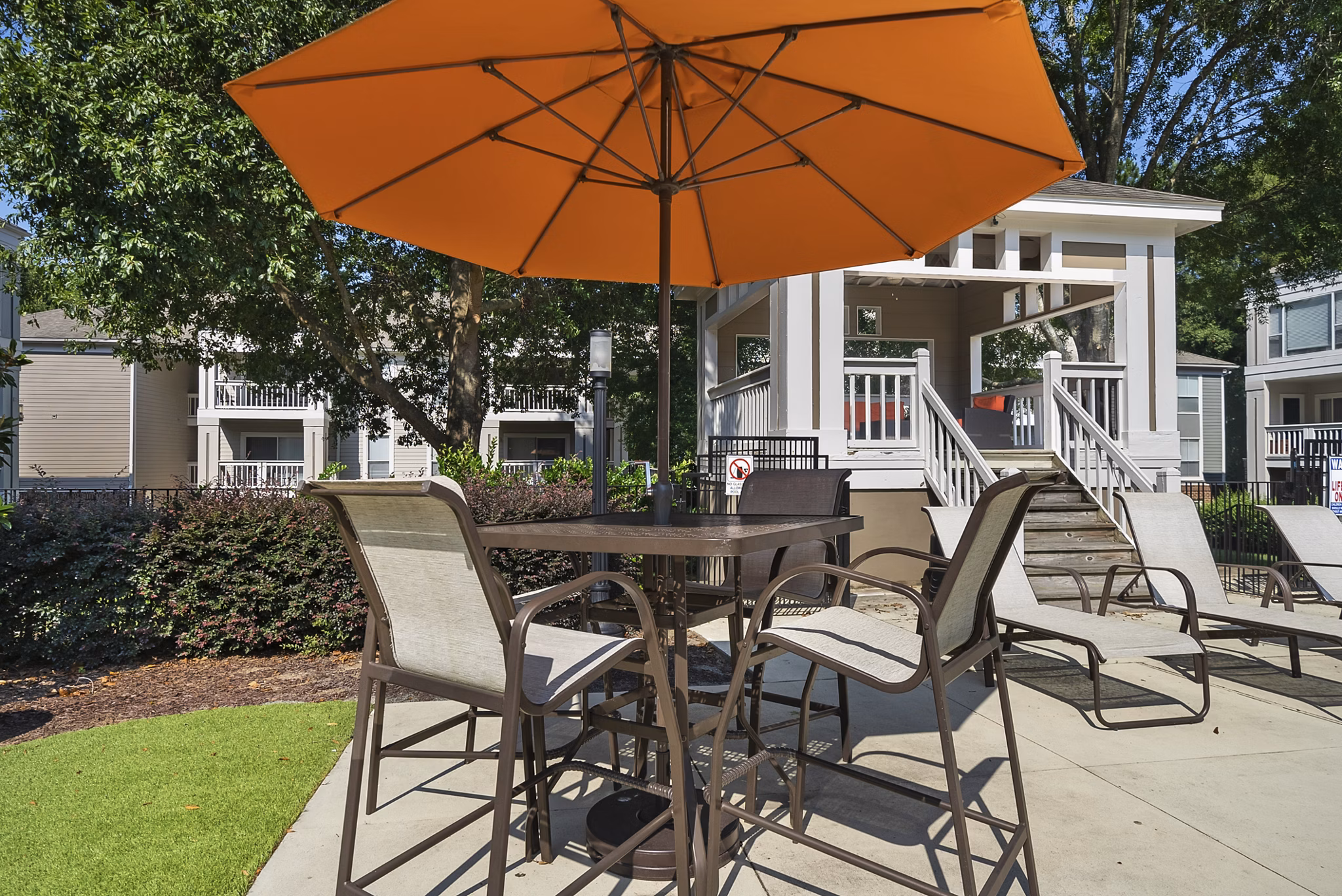 Stylish outdoor patio with modern seating at Concord Apartments, perfect for relaxation and social gatherings