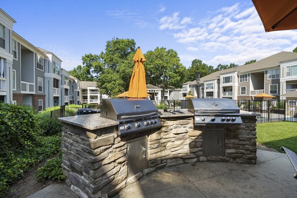 Grill area with modern appliances at Concord Apartments, perfect for outdoor gatherings and dining