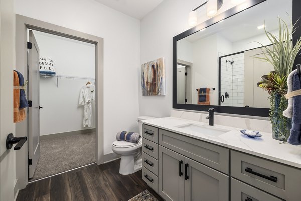Modern bathroom with sleek fixtures at The Easley Apartments in a luxury Greystar community