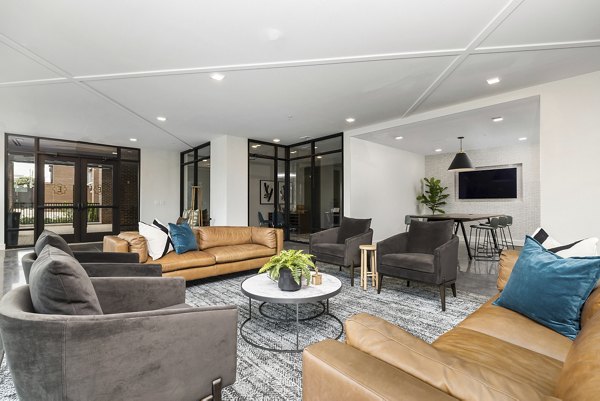Clubhouse with modern design and ample seating at The Easley Apartments, a luxury community by Greystar