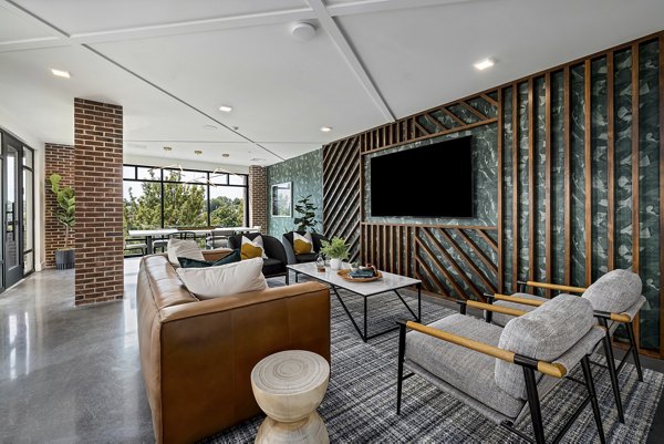 Elegant clubhouse with cozy seating and modern decor at The Easley Apartments