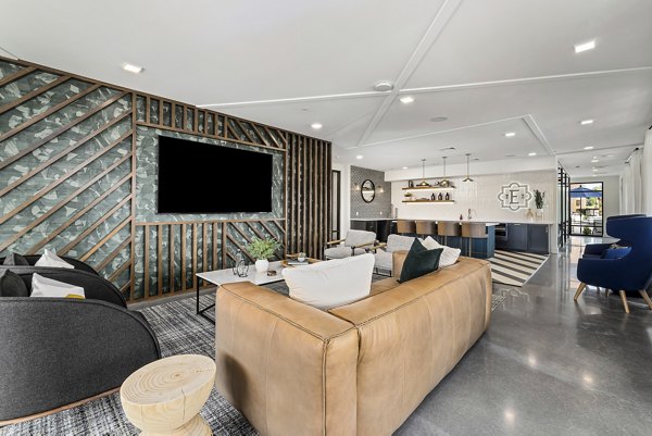 Clubhouse featuring modern seating and entertainment options at The Easley Apartments
