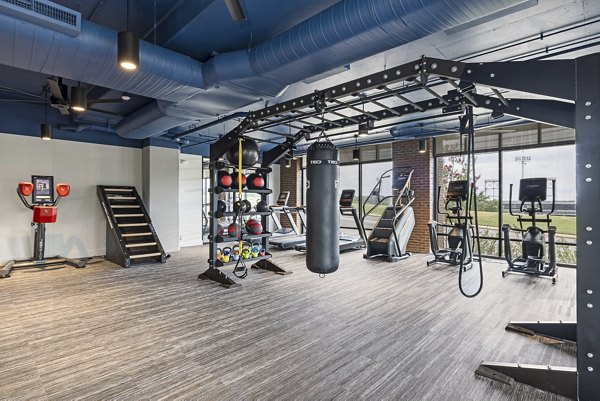 Modern fitness center with state-of-the-art equipment at The Easley Apartments