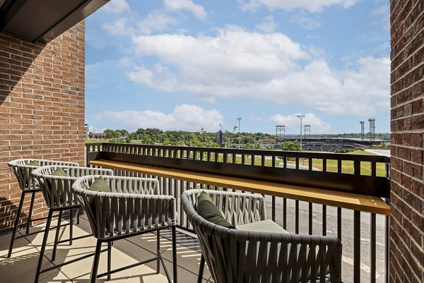 Spacious outdoor patio with modern seating at The Easley Apartments