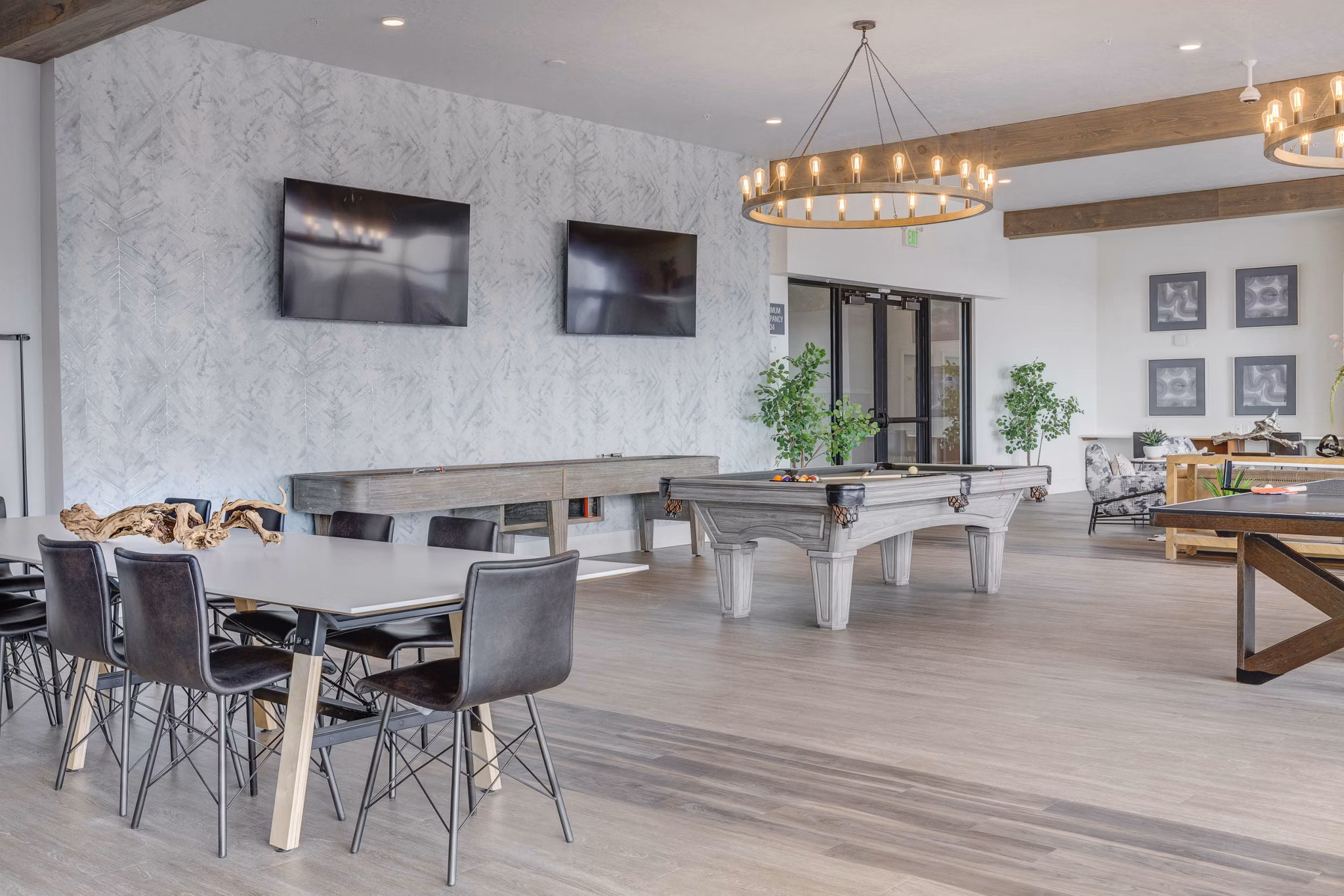 Clubhouse with modern seating and large windows at The Heights at Legend Hills Apartments