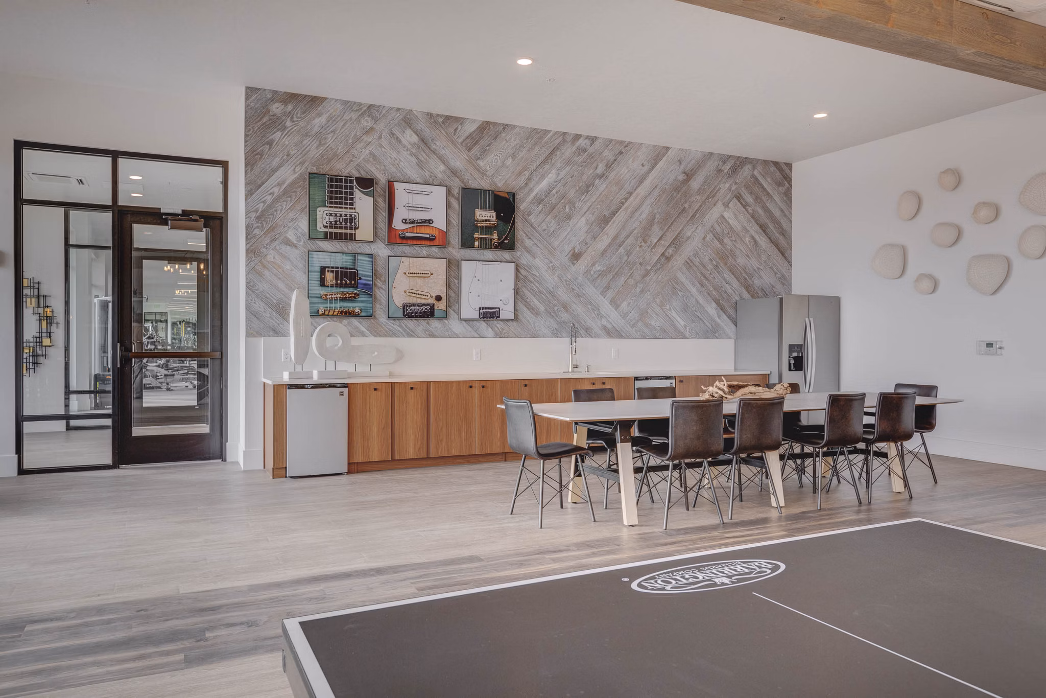 Clubhouse with spacious seating and billiards at The Heights at Legend Hills Apartments