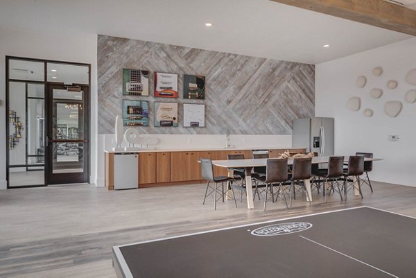 Clubhouse with spacious seating and billiards at The Heights at Legend Hills Apartments