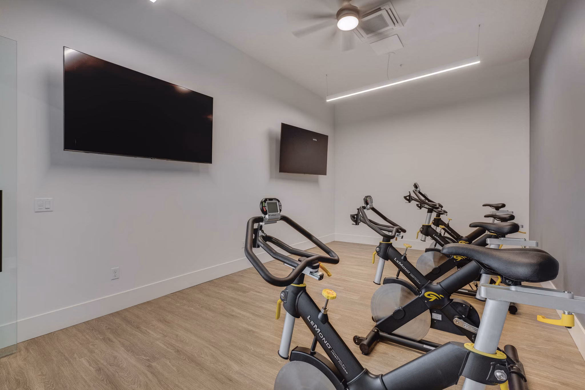 Yoga and spin studio with modern equipment at The Heights at Legend Hills Apartments