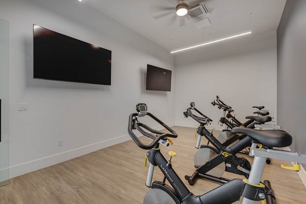 Yoga and spin studio with modern equipment at The Heights at Legend Hills Apartments